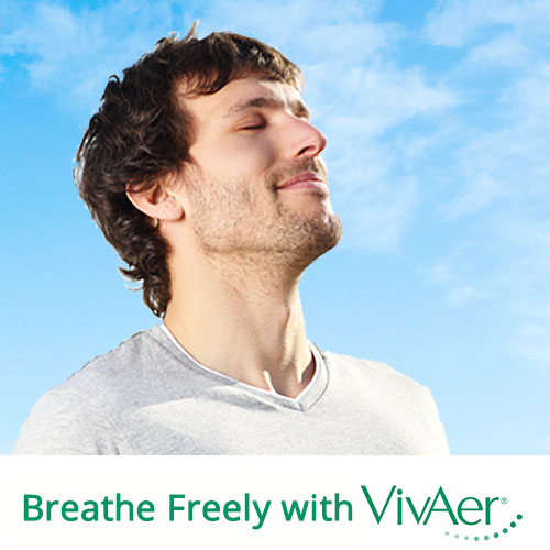 A man breathing with a blue sky behind him. "Breath Freely with VivAer"