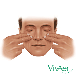 Place fingertips on your cheeks, just outside your nose. Pull gently toward your ears. 